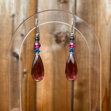 Purple earrings, crystal accents.