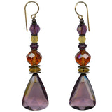 Light amethyst dangle earrings. Mauve German glass with Austrian crystal in topaz and amethyst. Czech glass in shades of light topaz. Metal trim is antiqued bronze, from our own tooling. All handwork done in the USA.