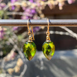 Green glass earrings with gold trim. Handmade in the USA.