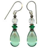 A pair of green glass drop earrings with clear top beads and emerald green crystals, featuring metal trim in an antique bronze finish.