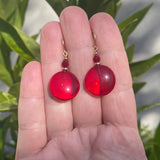 Red glass and crystal earrings with gold accents.