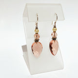 Pale peach glass drop earrings with glass pearl accents.