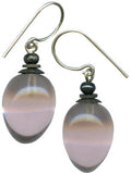 Mauve glass earrings. Glass drops from Germany, designed by Allen Owen. Metal trim is antiqued bronze with sterling silver ear wires. All handwork done in the USA.