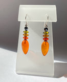 Orange glass drop earrings with Czech glass accents and hematite Austrian crystal top beads. Handmade in the USA.