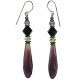 Purple prism earrings on a white background. 