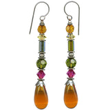 A pair of long dangle earrings with silver french wires and faceted beads in amber, yellow, green, pink, and large topaz teardrop drops, shown on a plain white background.