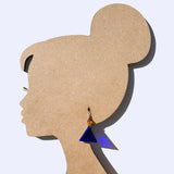 Blue triangle-shaped earrings on a silhouette of a woman's head.