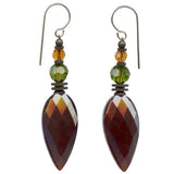 Garnet glass drop earrings. Topaz and green Austrian crystal accents. Metal trim is antiqued bronze with sterling silver ear wires. All handwork done in the USA.