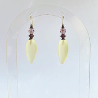 Frosted yellow glass earrings. Focal beads are light amethyst Austrian crystal with deep purple Czech glass accents. Sterling silver ear wires. All handwork done in the USA.