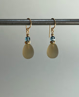 Frosted light smoke topaz glass earrings. Top beads are indigo Austrian crystal. Ear wires are 14 karat gold filled. All handwork done in the USA.
