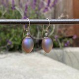 Frosted taupe earrings with iridescent sheen.