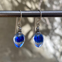 Blue and clear two-toned glass earrings.