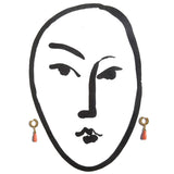 A stylized drawing of a face, shown with two small dangling earrings on either side against a plain white background.