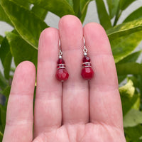 Red glass earrings with red rhinestones.