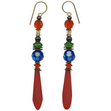 Pair of earrings with colorful beads and red teardrop-shaped pendants on a white background