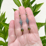 Green crystal earrings.