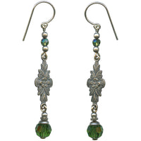 Pair of silver earrings with green beads on a white background