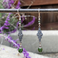 Tourmaline green crystal earrings with silver filigree.