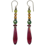 Dark rose glass and crystal earrings. Light garnet glass prisms designed by Allen Owen and made for us in Germany. Accents are Austrian crystal in tourmaline green and topaz with green and pink Czech glass. Trim is antiqued silver plate from our own tooling with sterling silver ear wires. Metro 3 earrings measure 2 1/4 inches in length. All handwork done in the USA.