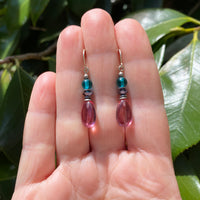 Handmade pink earrings. German glass with teal Czech top beads and jet Austrian crystal. Made in the USA.