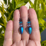 Blue iridescent glass earrings.