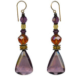 Light amethyst dangle earrings. Mauve German glass with Austrian crystal in topaz and amethyst. Czech glass in shades of light topaz. Metal trim is antiqued bronze, from our own tooling. All handwork done in the USA.