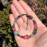 Beaded bracelet on a hand.