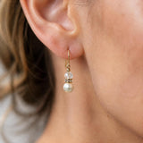 Pearl and Czech glass earrings on a model
