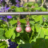 Dusty rose pearlized crystal earrings. Top beads are pink Austrian crystal. All handwork done in the USA.