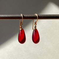 Red glass earrings.