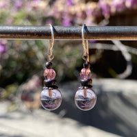 Periwinkle purple glass earrings. Pink Austrian crystal top beads. Bronze accents, silver wires.