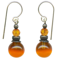 Orange glass and crystal earrings with bronze accents.