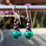 Teal glass earrings. Amethyst Austrian crystal top beads. Bronze trim.