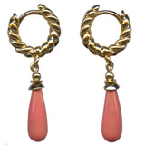 A pair of gold hoop earrings with twisted rope details and teardrop-shaped coral pendants, shown against a plain white background.