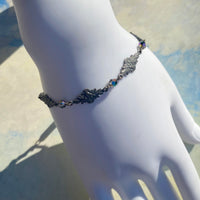 Decorative bracelet on a mannequin with a blurred background