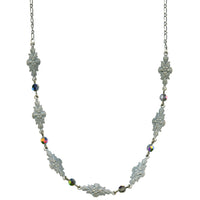 Silver necklace with floral designs and multicolored beads on a white background