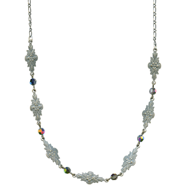 Silver necklace with floral designs and multicolored beads on a white background