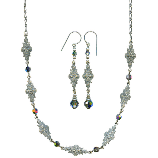 Silver necklace and earrings set with floral designs and colorful beads on a white background