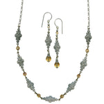Jewelry set with necklace and earrings on a white background