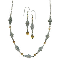 Jewelry set with necklace and earrings on a white background
