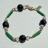 Art Deco era glass bracelet. Handmade bracelet on a gray background.