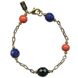 Gold bracelet with Czech glass accents on a white background.