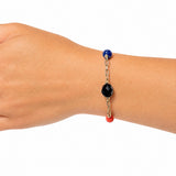 Handmade gold bracelet on a model's arm. Shown for scale. Czech glass beads and antique Japanese beads. 