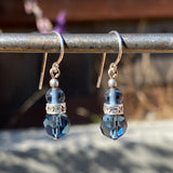 Blue glass earrings with rhinestone accents.
