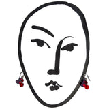 Illustration with red glass earrings.