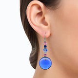 Model wearing blue sapphire earring.