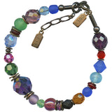 Multicolored beaded bracelet with metal clasp on a white background
