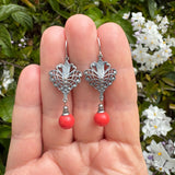 Antique coral colored Japanese glass beads with sterling silver dipped filigree. Ear wires are sterling silver. Handmade in the USA.