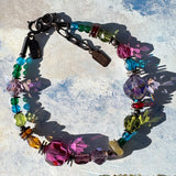 Multi colored crystal bracelet with bronze accents.