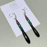 Antique Czech glass earrings on a display card.